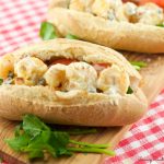 Shrimp Po'boys - served with a delicious creole Remoulade sauce. Shrimp is battered in cornmeal and oven fried to perfection. A perfect addition to your Mardi Gras celebration